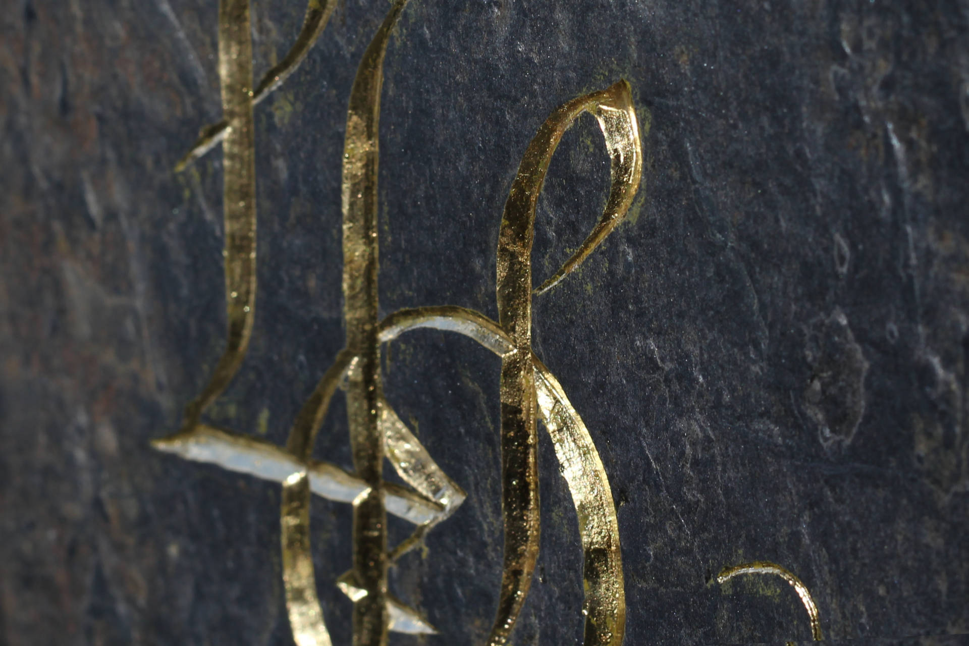 This is a close up image of the golden letters from the LOL acronym.
